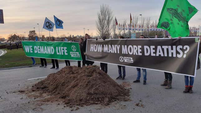 Environmental activists dump horse manure outside the United Nations climate summit Saturday to subtlety signal these talks are horseshit. 