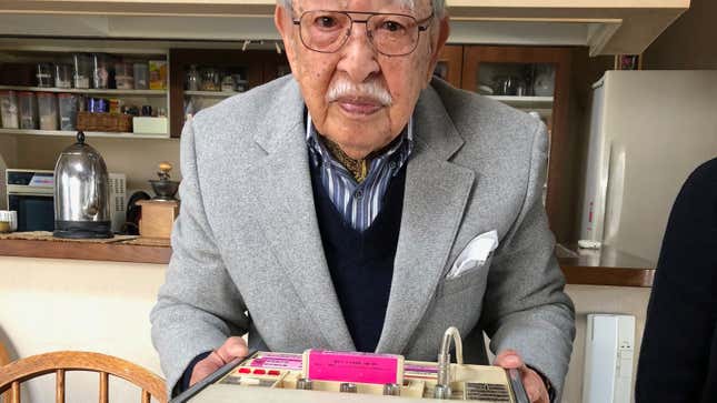 Shigeichi Negishi with his invention, the “Sparko Box,” the first karaoke machine.