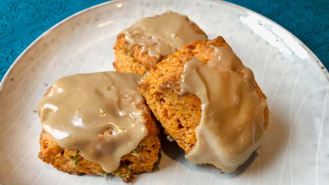 Scones covered in gravy on plate