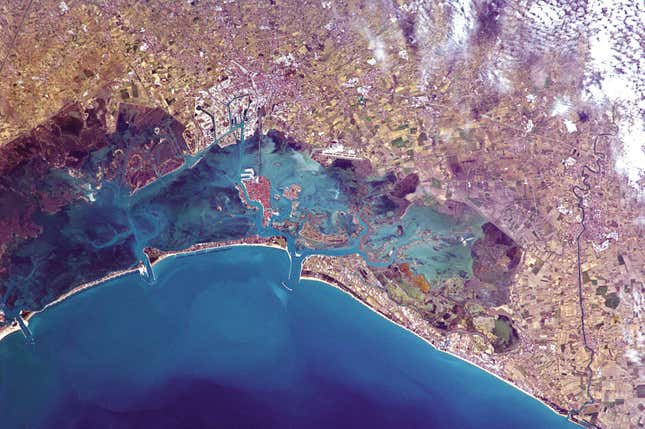Venice, floating, connected to the mainland by only the thinnest of umbilical cords.