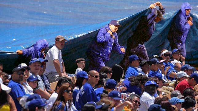 Image for article titled Dodgers Grounds Crew Places Tarp Over Unsightly Crowd