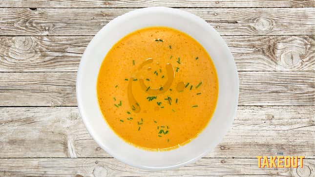 Magic Carrot Soup on wood tabletop background