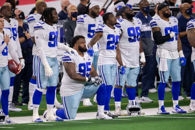 Dallas Cowboys defensive tackle Dontari Poe (95) kneels during the National Anthem to bring attention to social justice issues before an NFL football game against the Arizona Cardinals, Monday, Oct. 19, 2020, in Arlington, Texas. Arizona won 38-10.