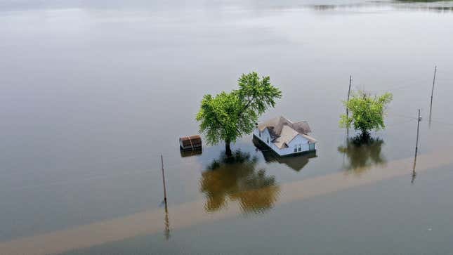 Floodwaters from the Mississippi River rise around a home on June 1, 2019 in West Alton, Missouri.