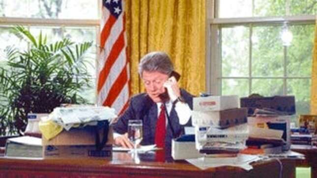 As shit continues to pile up on his desk, President Clinton phones
members of Congress to rally support for his proposed National Week Off.