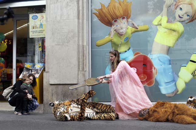 Image for article titled Here Are Some Pictures of Greenpeace Barbie Cutting Off a Costume Tiger&#39;s Head With a Chainsaw