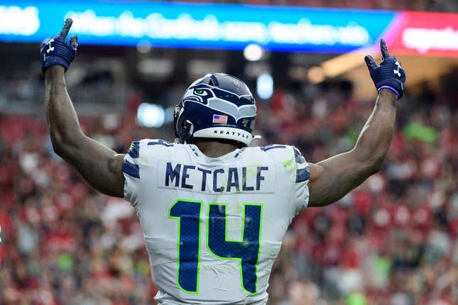 Wide receiver D.K. Metcalf #14 of the Seattle Seahawks celebrates a touchdown that was scored in the second half of the NFL game against the Arizona Cardinals at State Farm Stadium on September 29, 2019 in Glendale, Arizona. 
