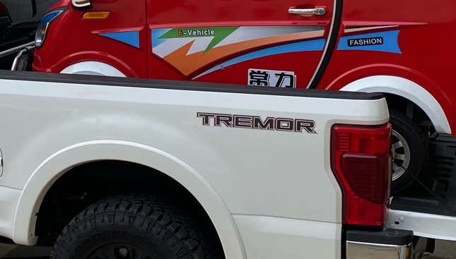 Image for article titled The 2021 Ford F-250 Lariat Tremor With A Ramp Kit Makes A Pretty Great Way To Haul A Changli Across The Country