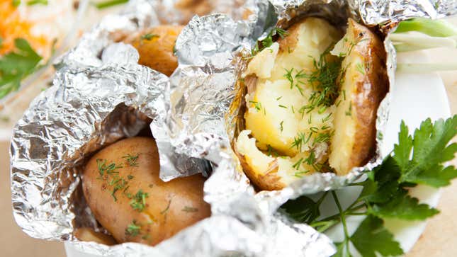 Photo of potatoes wrapped in aluminum foil