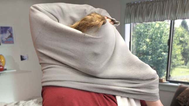 Image for article titled Area Man Locked In Protracted Battle With Sweatshirt Neckhole