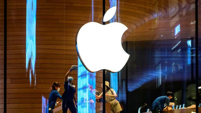 The Apple logo is seen on a window of the company’s store in Bangkok on February 14, 2021. 