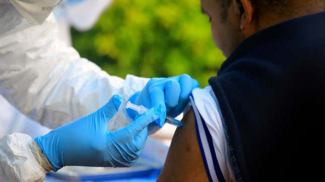 A man in the Democratic Republic of Congo getting a dose of the experimental Ebola vaccine.