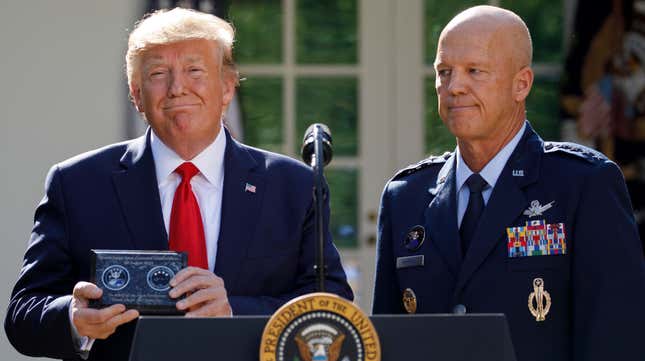 Gen. John Raymond gave President Donald Trump a plaque at the U.S. Space command re-establishment ceremony