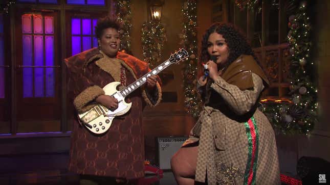 Lizzo, right, and guitarist Celisse, both wearing Dapper Dan for Gucci, perform ‘Truth Hurts’ on SNL.