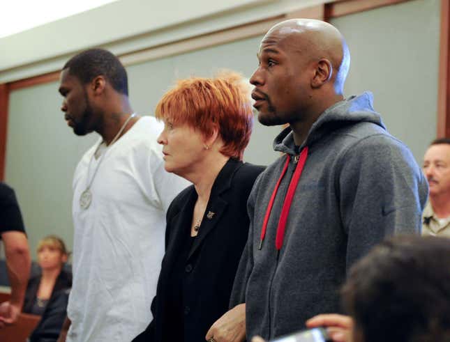 Floyd Mayweather, right, at his 2010 sentencing, accompanied by 50 Cent.