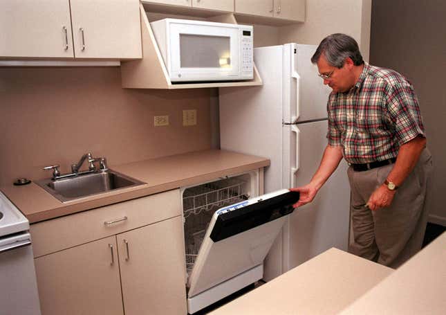 Roger Fisher, director of residential services, gives a tour of the kitchen complete with microwave, refrigerator, and a dishwasher at the Tom Brown/Pete Wright Residential Community on the campus of Texas Christian University in Fort Worth, Texas.