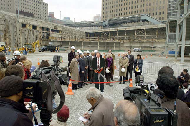 Onlookers tolerate the unveiling ceremony at Ground Zero.
