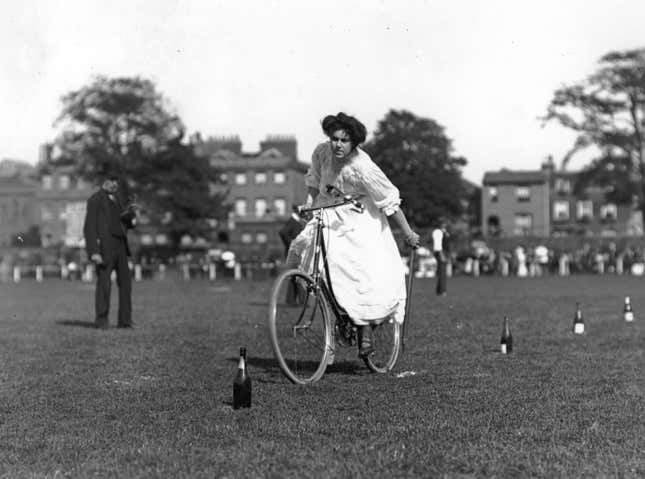 July 1905: A young woman competes in a gymkhana for bicycle riders at Richmond.