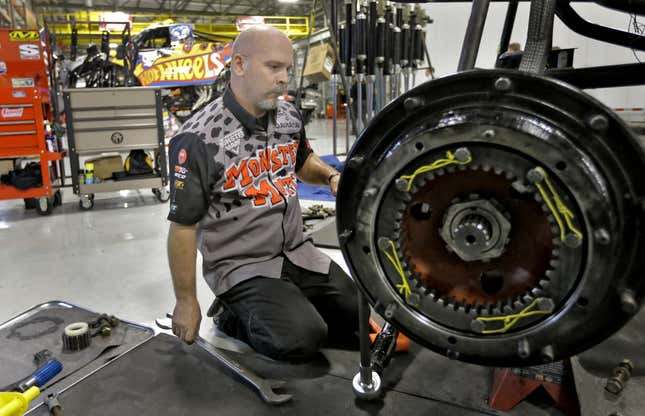 John Sweeney works on the axle of a monster truck Nov. 25, 2014, at Feld Entertainment in Ellenton, Fla.