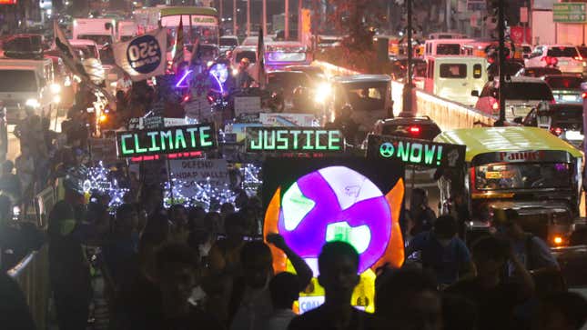 Philippine activists take part in a rally calling for action against climate change in Manila on November 29, 2019.