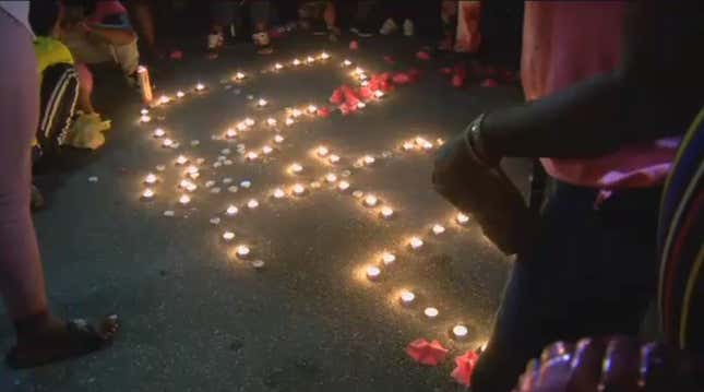 Friends and family attend a candlelight vigil in memory of Bee Love Slater.