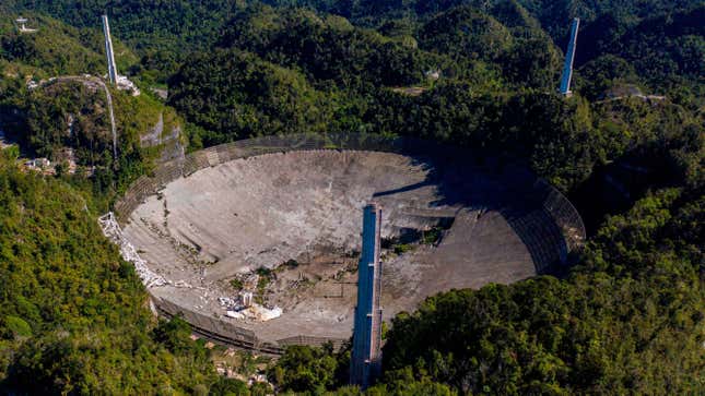 Aerial footage showing the damaged dish at the Arecibo Observatory and three support towers. 