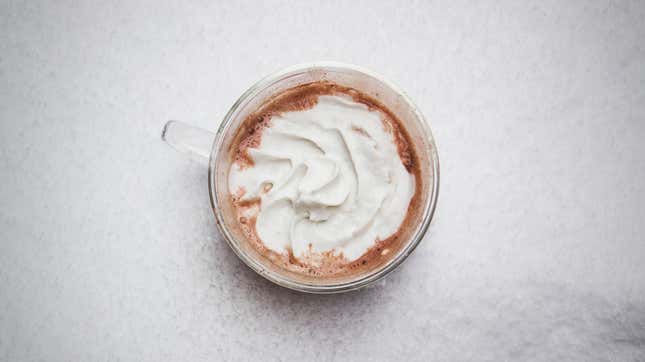 Mug of hot cocoa topped with whipped cream