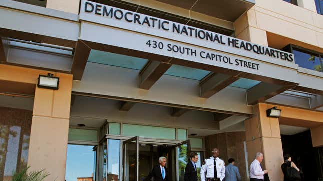 In this June 14, 2016 file photo, people stand outside the Democratic National Committee (DNC) headquarters in Washington.