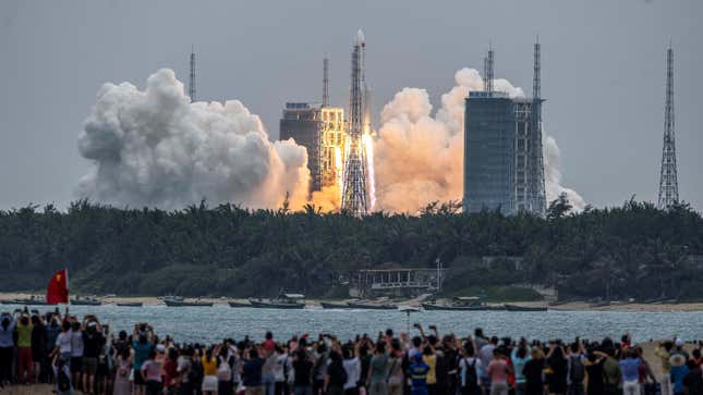 Crowds watched the Tianhe module blast off aboard a rocket in Hainan, China.
