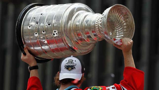 Image for article titled Stanley Cup Shot 11 Times During Chicago Blackhawks Victory Parade