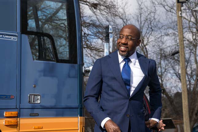 Georgia Democratic Candidate Rev. Raphael Warnock meets with supporters on January 5, 2021 in Marietta, Georgia. Polls have opened across Georgia in the two runoff elections, pitting incumbents Sen. David Perdue (R-GA) and Sen. Kelly Loeffler (R-GA) against Democratic candidates Rev. Raphael Warnock and Jon Ossoff.