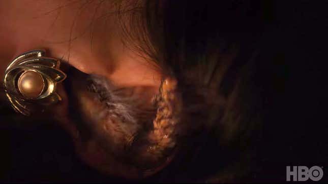 Ji-Ah’s foxtail emerging from her ear.