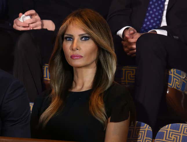 Image for article titled Melania Trump Looks Down On Husband From Gallery With Loving Grimace