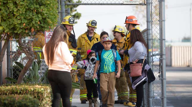 Students being evacuated from Park Avenue Elementary in Cuadhy, California on Jan. 14, 2020 after a Delta Airlines flight dumped fuel over the area.