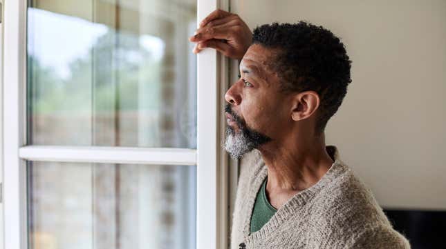Man staring longingly out of window