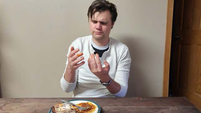Image for article titled Napkinless Man With Grease-Covered Fingers Realizes He Trapped In A Prison Of His Own Creation