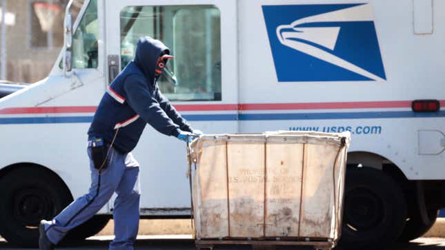 Postal workers prepare mail for delivery at the Kilbourn Park post office on May 09, 2020 in Chicago, Illinois.