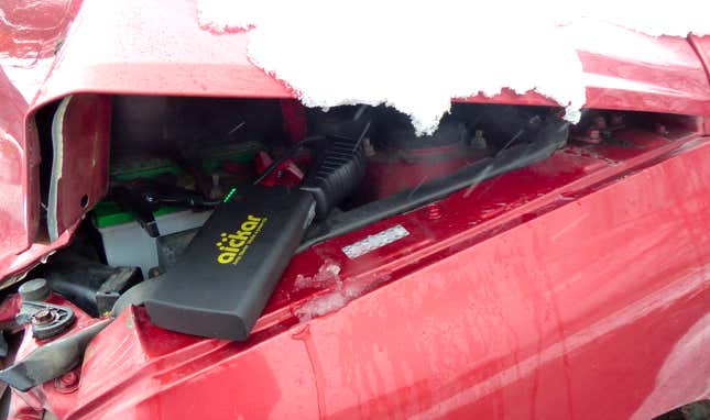 Image for article titled You Haven't Reached Rock Bottom Until You've Got A Totaled Kia Rio Stuck In Your Backyard