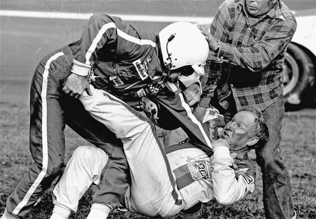 Bobby Allison (l) stands over Cale Yarborough after a collision between Yarborough and Allison’s brother Donnie on the last lap of the Daytona 500 February 18, 1979.