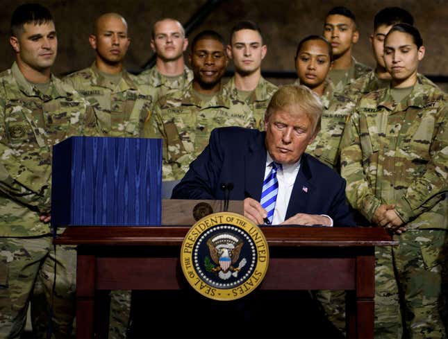 Image for article titled Trump Slammed For Signing John McCain Defense Bill Without Praising How Many People It Will Kill
