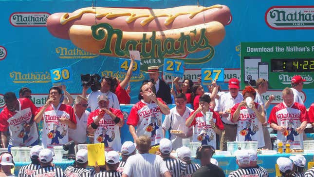 Joey “Jaws” Chestnut and Matt Stonie compete in the 2019 Nathans Famous Fourth of July International Hot Dog Eating Contest at Coney Island on July 4, 2019 in New York City.