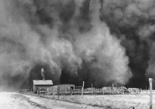 A dust cloud approaches a ranch in Boise City, Oklahoma in 1935.  

