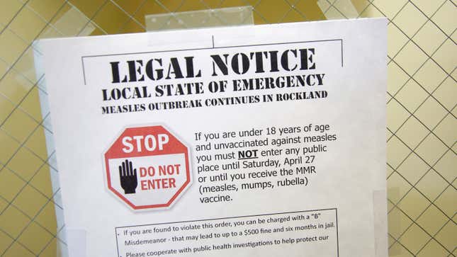 A sign explaining a recent state of emergency on display at the Rockland County Health Department in Pomona, New York on March 27, 2019.