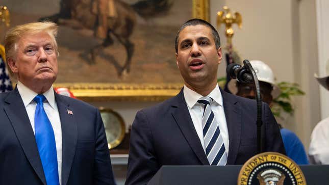US President Donald Trump listens to Federal Communications Commission (FCC) chairman Ajit Pai speak during an announcement about 5G network deployment in the Roosevelt Room at the White House in Washington, DC, on April 12, 2019.