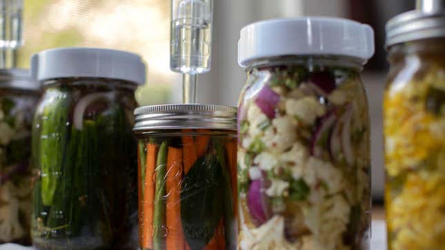 jars of vegetables being fermented