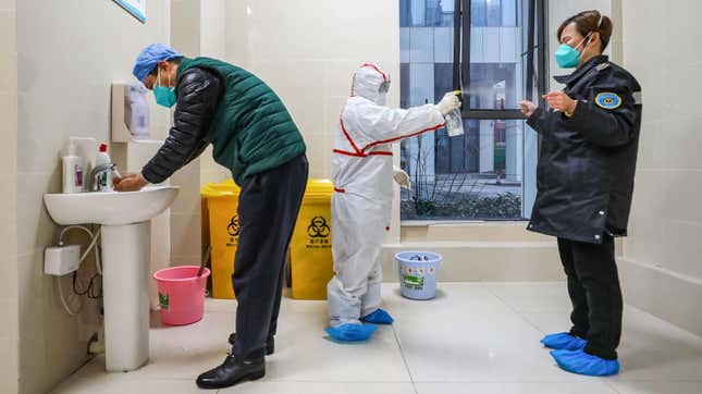 This photo taken on January 26, 2020 shows medical staff members wearing protective clothing to help stop the spread of a deadly virus which began in Wuhan in China’s central Hubei province.
