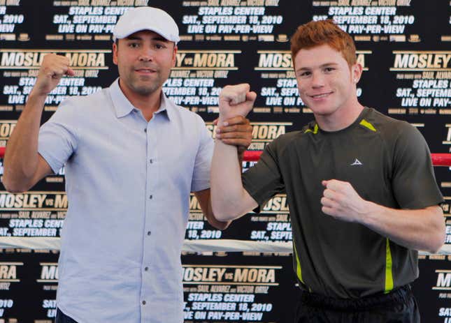 Oscar De La Hoya and “Canelo” Álvarez in 2010. Photo by Damian Dovarganes/AP