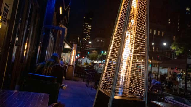 A gas heater placed near outdoor tables at Tenzan restaurant in NYC