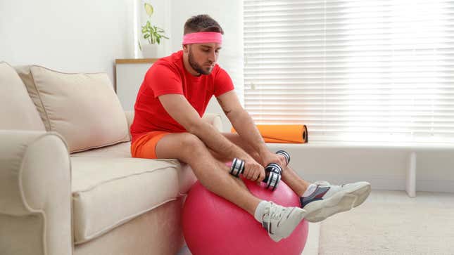 guy looking bored with exercise equipment