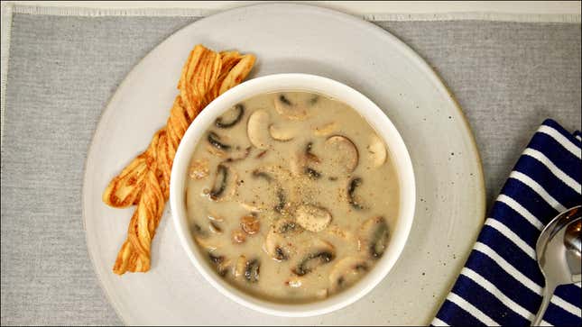 Bowl of Cream of Mushroom Soup on gray placemat